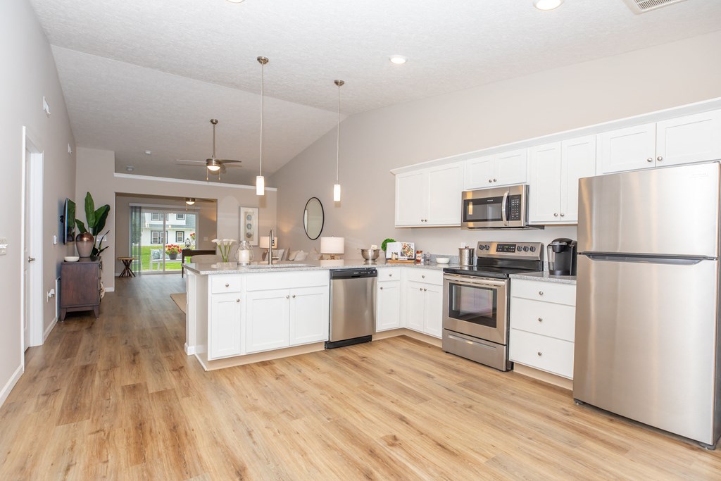 White kitchen with stainless steel appliances