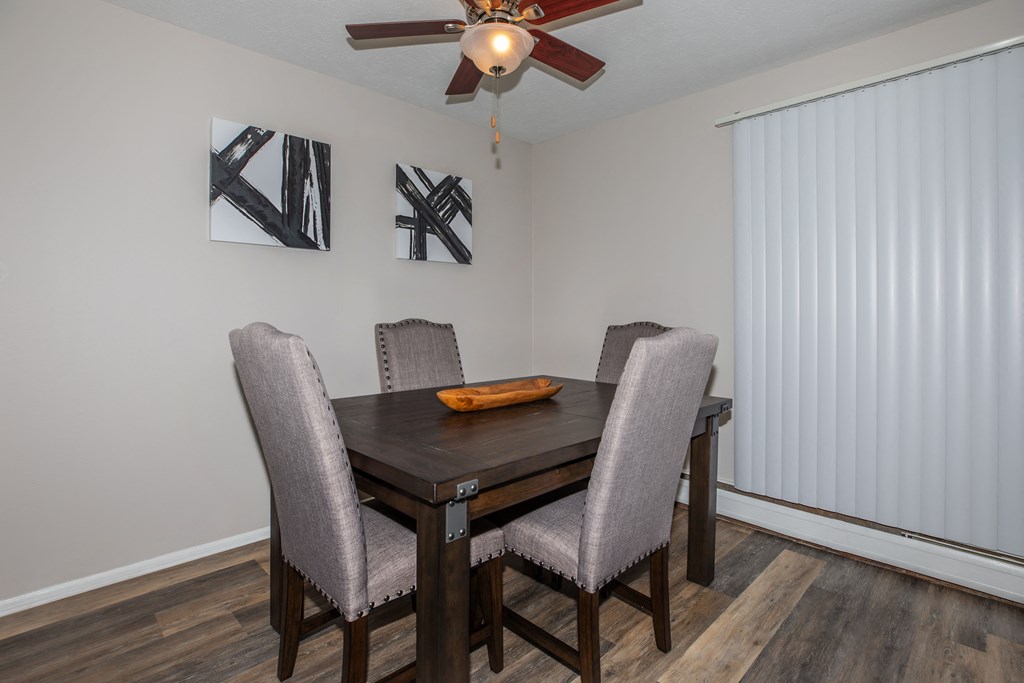 this is a photo of the dining room in a 2 bedroom apartment at deer hill apartments in