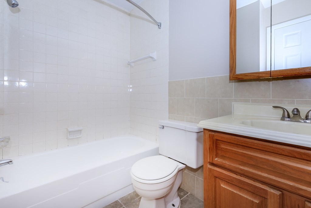 a bathroom with a toilet sink and bathtub
