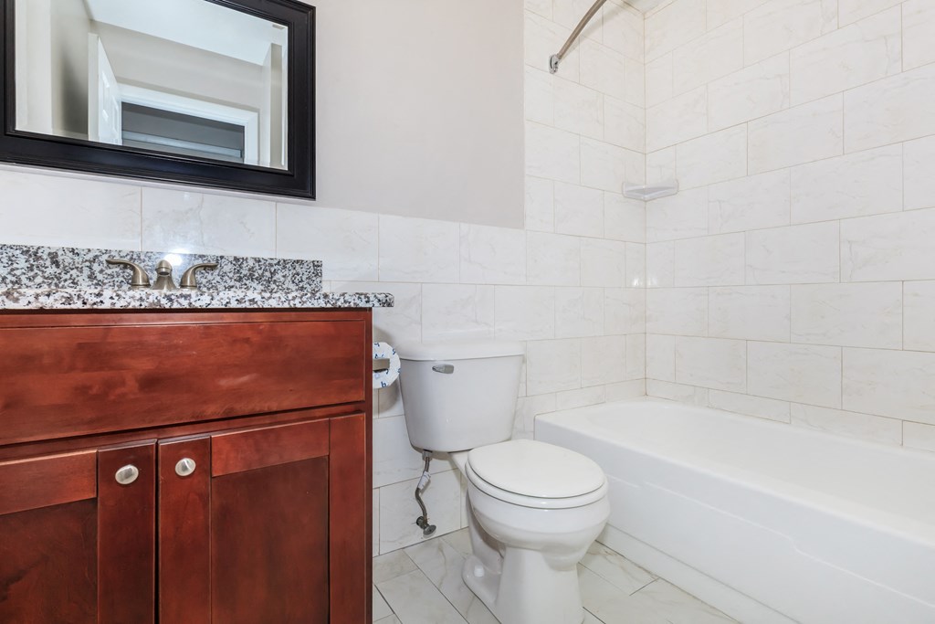 a bathroom with a sink toilet and bathtub