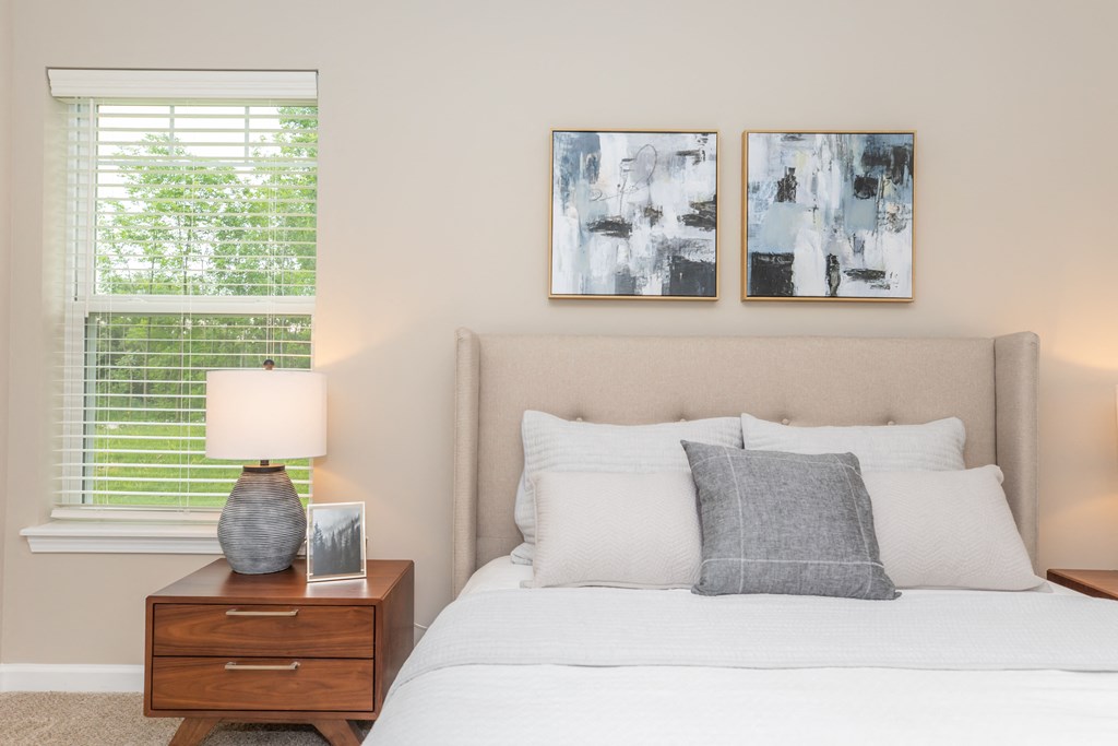 Furnished bedroom with ample natural lighting