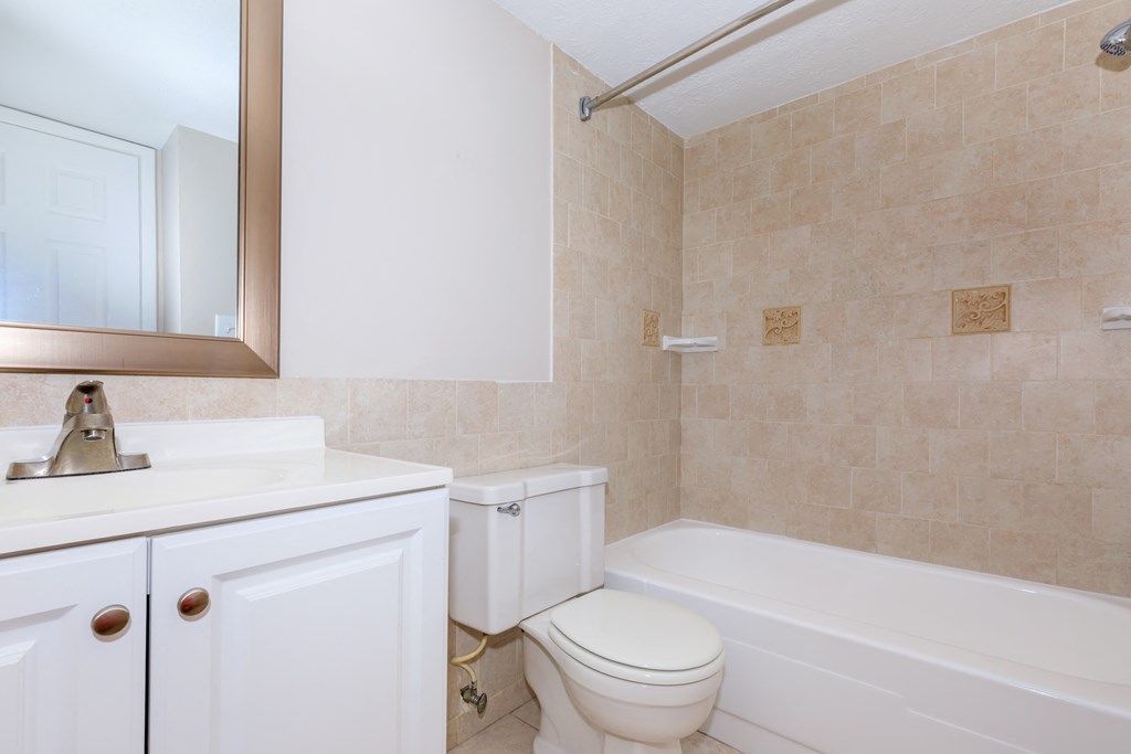 a bathroom with a sink toilet and bathtub