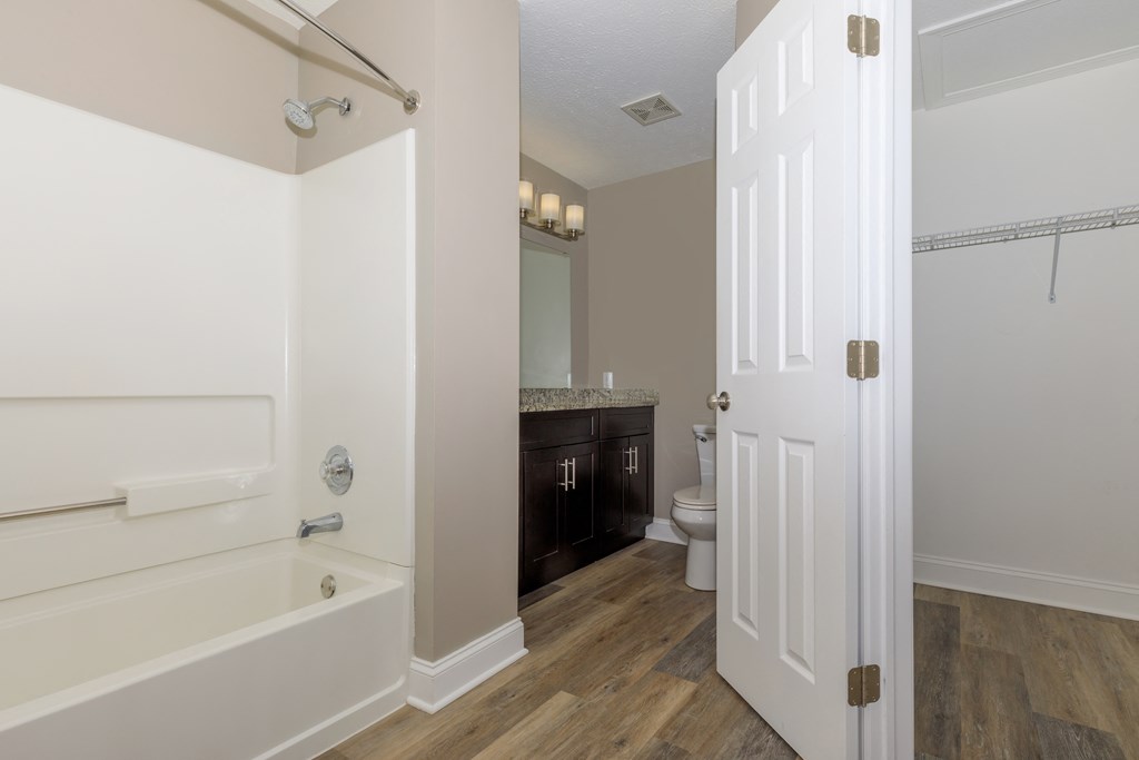 a bathroom with a bathtub and a sink