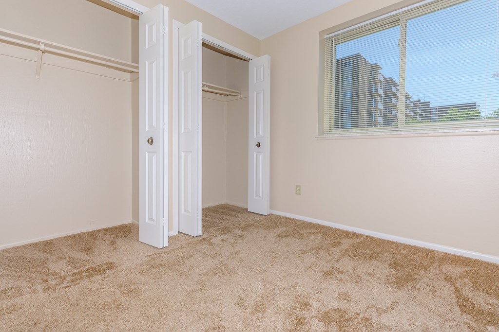 Standard unit master bedroom with carpeting and double closets  at 444 Park Apartments, Ohio, 44143