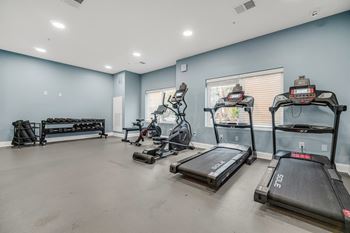 A spacious room with treadmills and other exercise equipment. at Park Lamont Townhomes Apartments, Cleveland, OH