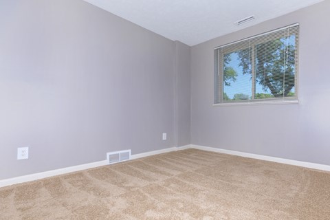 carpeted bedroom with window  at Parkview Apartments, Richmond Heights, Ohio