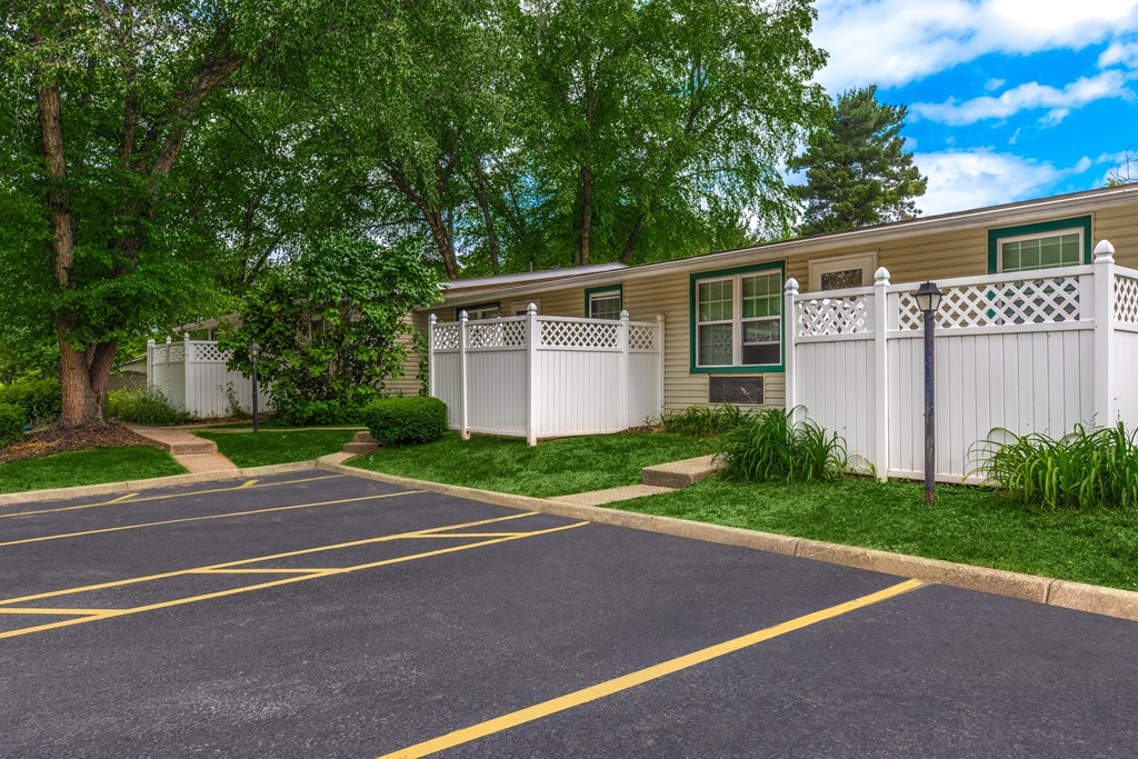a building with a white fence in front of it