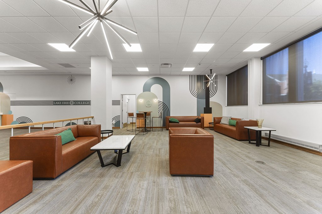 A modern office space with brown and green furniture.