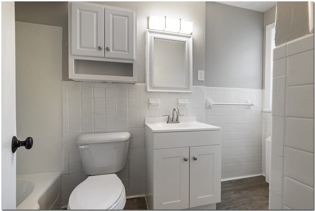 a bathroom with a toilet sink and bathtub