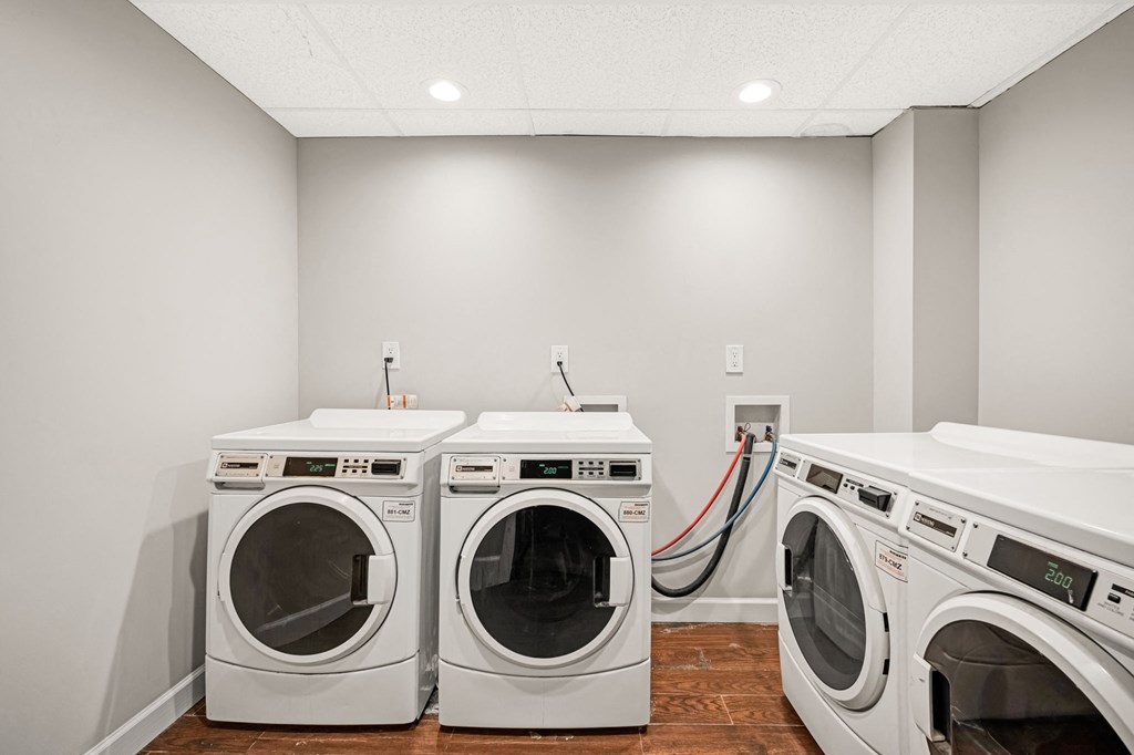 a washer and dryer in a laundry room with two washes and two