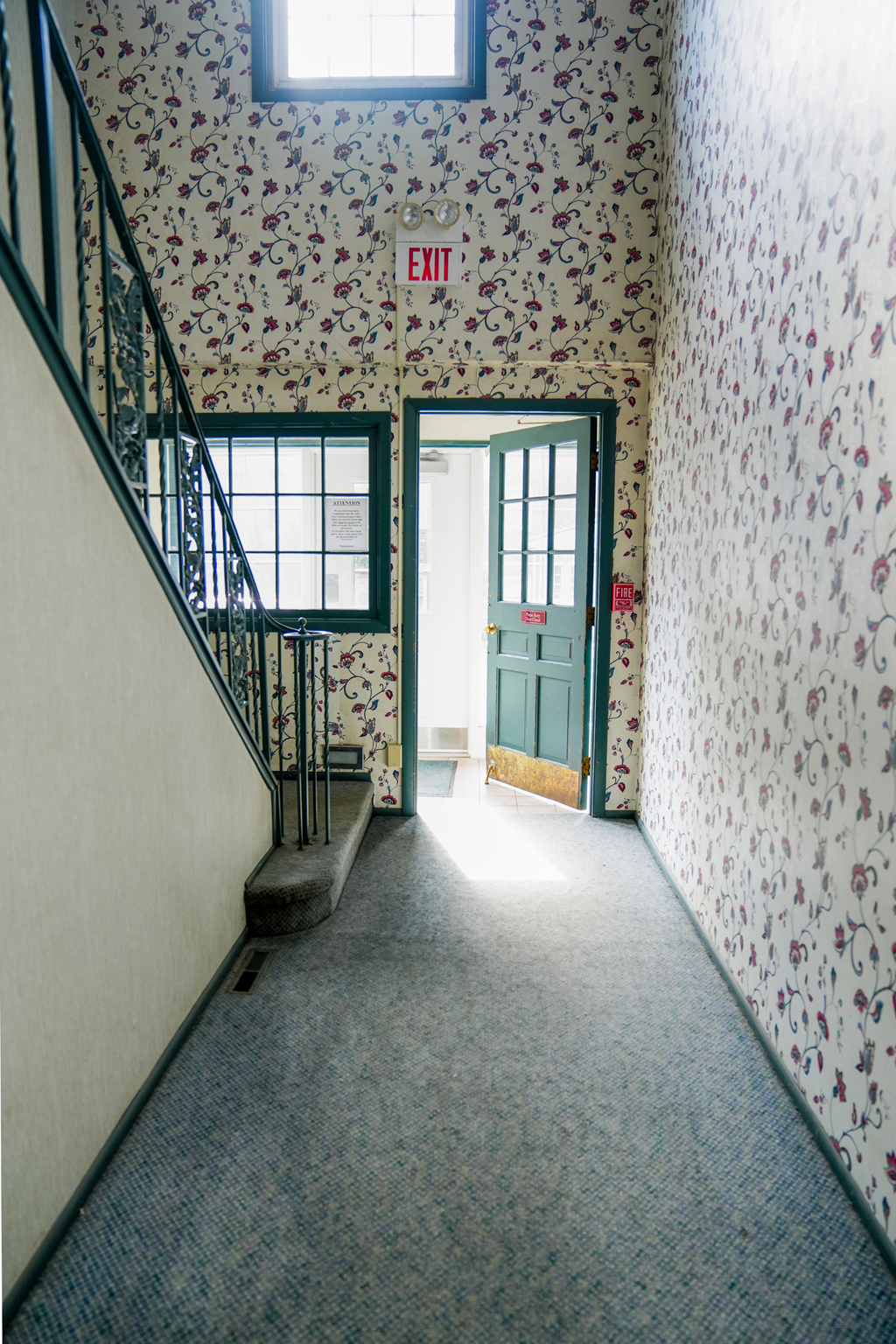 Entrance with floral wallpaper