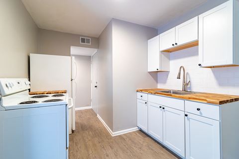Renovated kitchen with white cabinetry