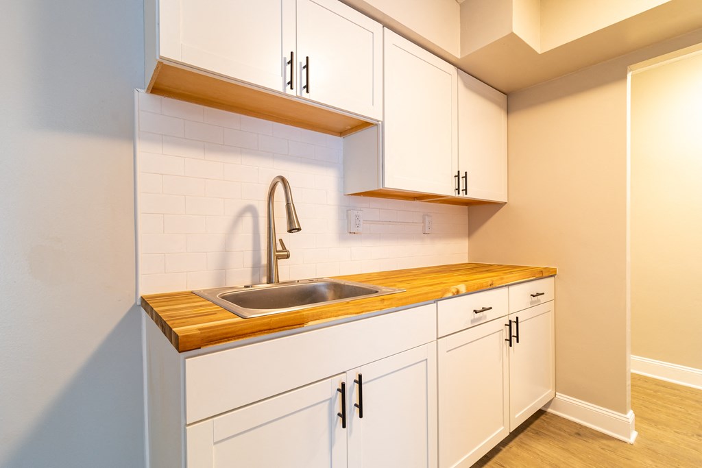 Upgraded kitchen with white cabinetry