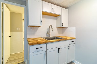Upgraded white kitchen with cabinetry
