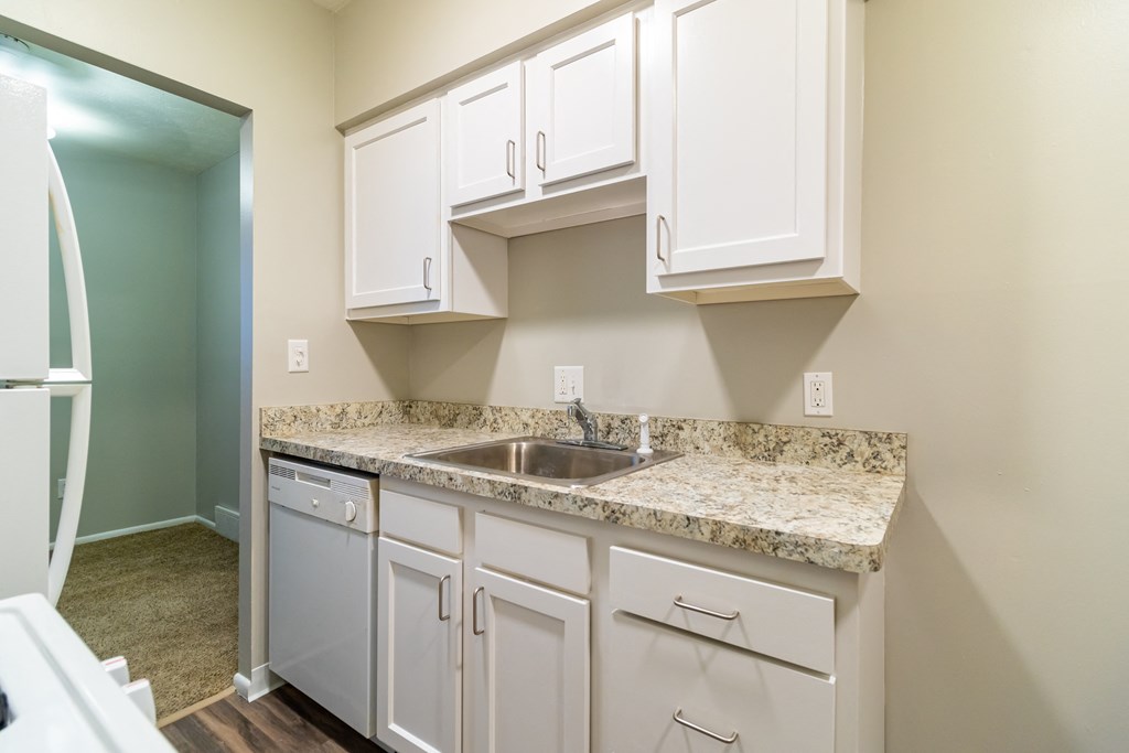 White kitchen with stainless steel sink