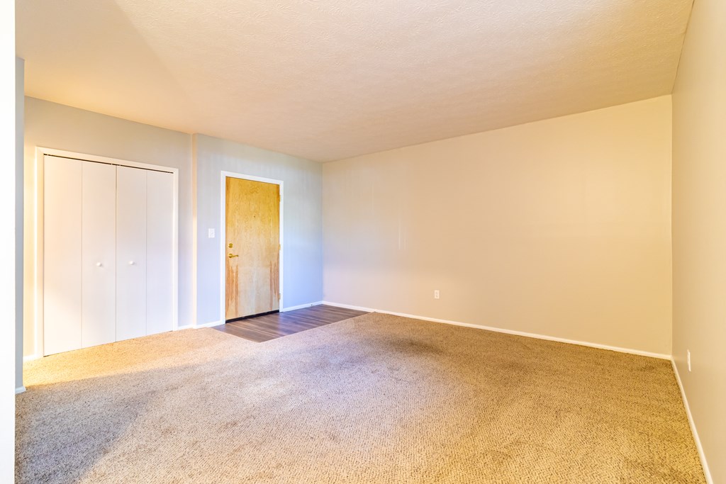Carpeted interior entryway of unit