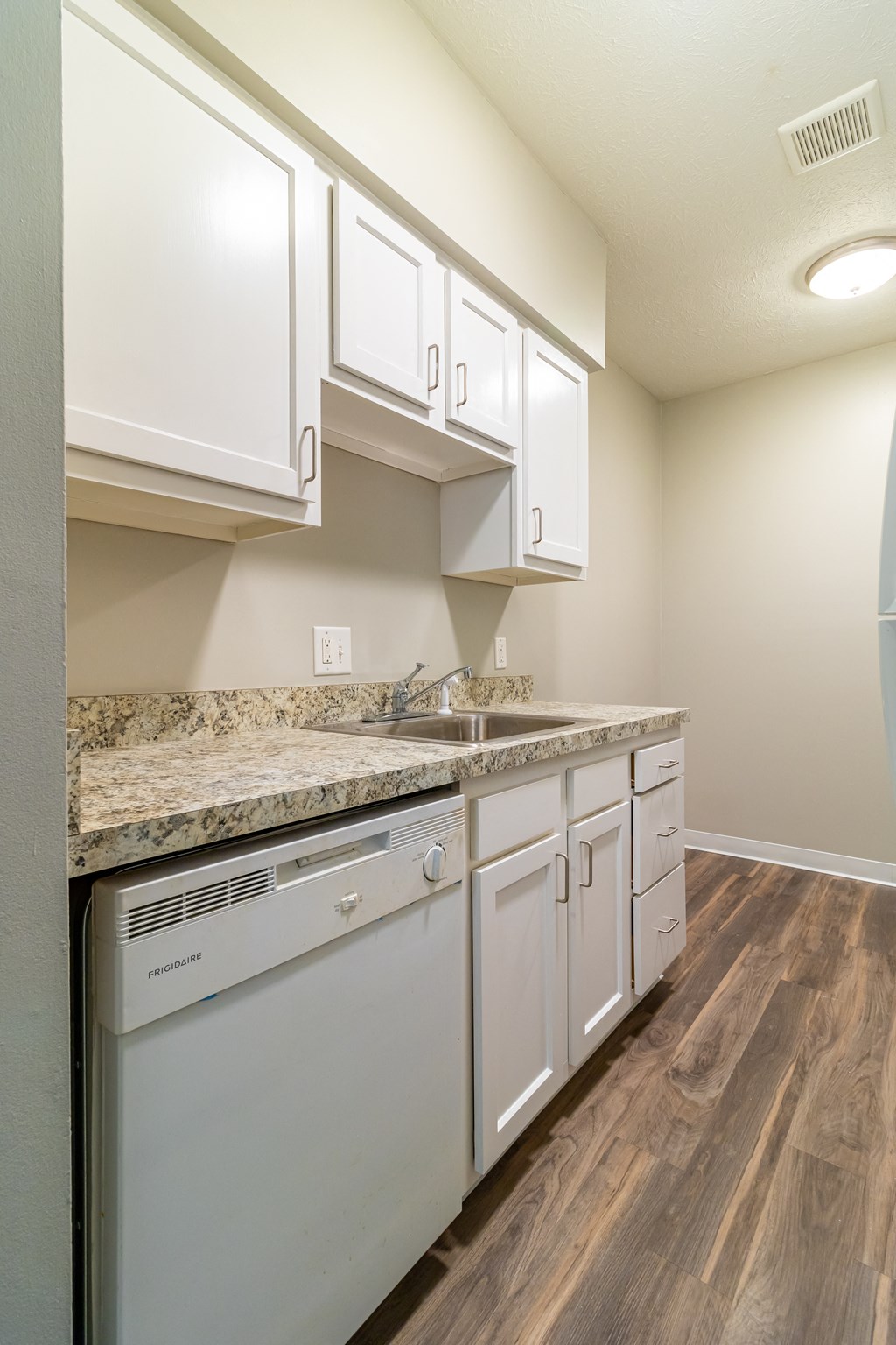 Kitchen with ample white cabinetry