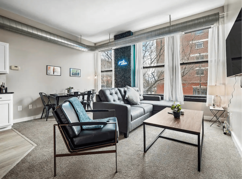 a living room with a couch and a table