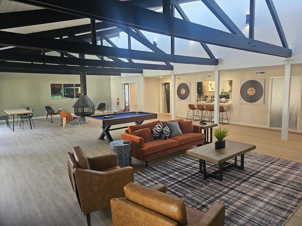 Lounge room with a couch, chairs, and a coffee table. at Commons At Waters Edge, Columbus Ohio