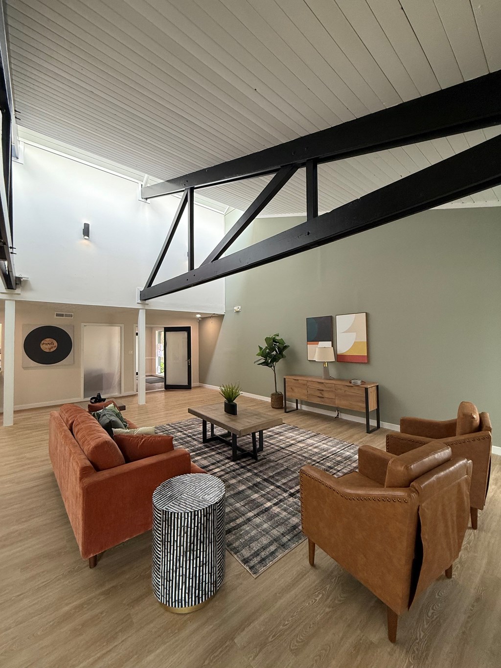 Lounge room with a couch, chairs, and a coffee table. at Commons At Waters Edge, Columbus Ohio