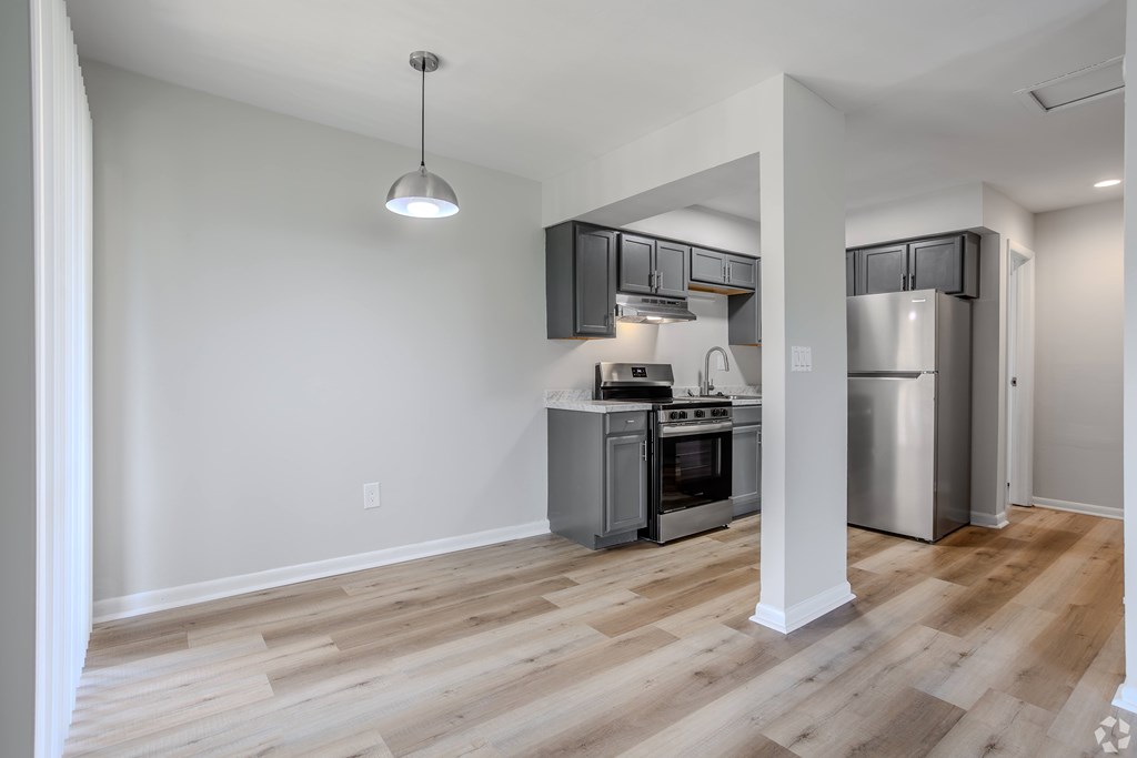 A kitchen with a refrigerator, oven, and stove. at Commons At Waters Edge, Columbus Ohio