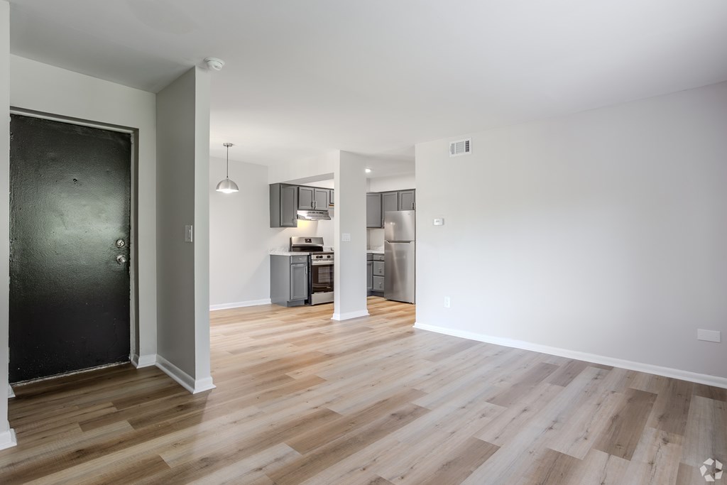 A room with a black door and wooden flooring. at Commons At Waters Edge, Columbus Ohio