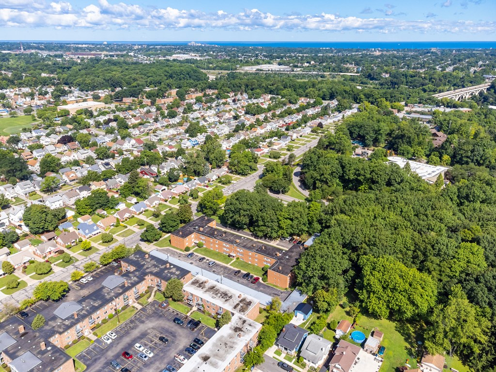 an aerial view of a neighborhood with houses and trees