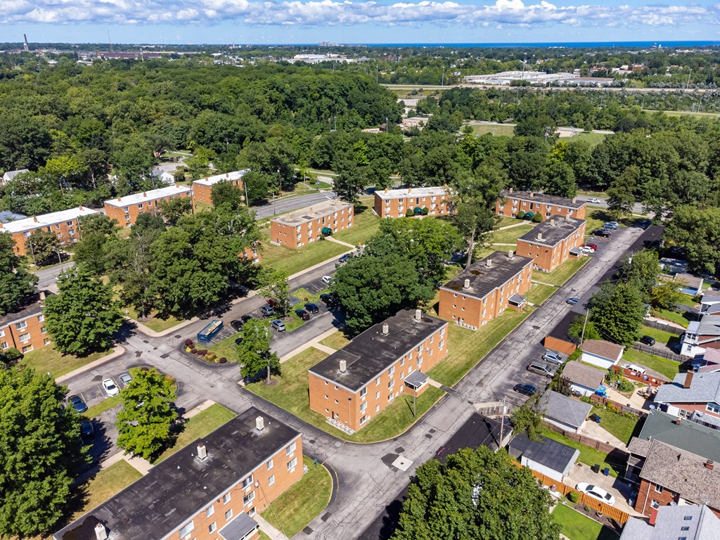 an aerial view of several brick buildings in a neighborhood