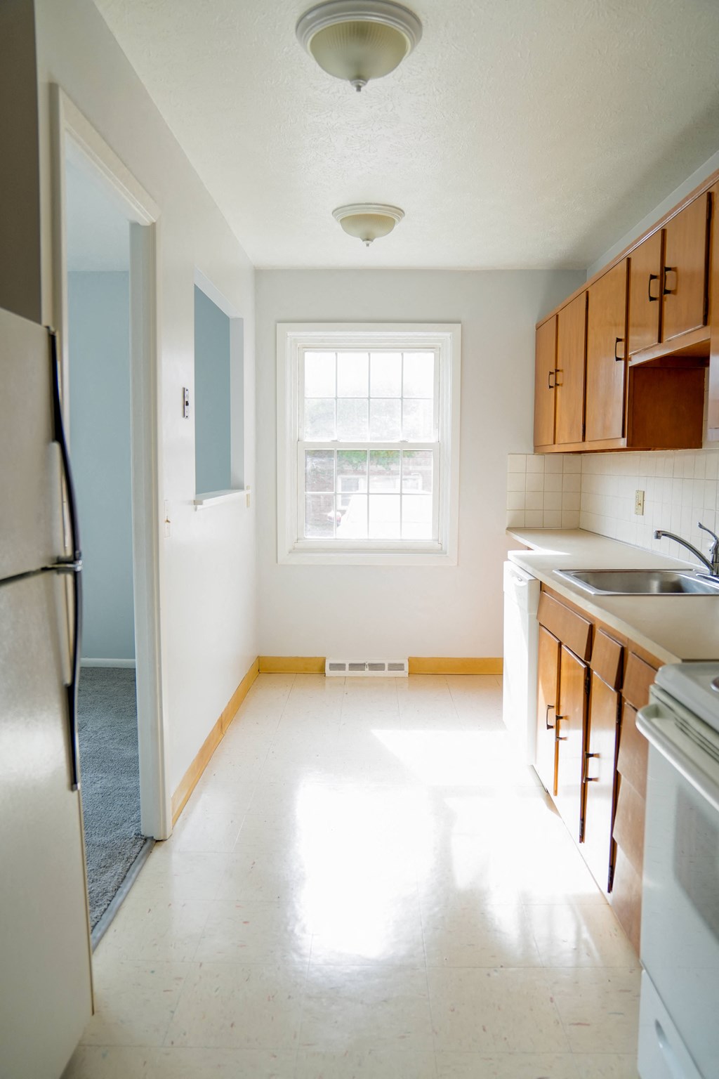 a kitchen with a sink and a window