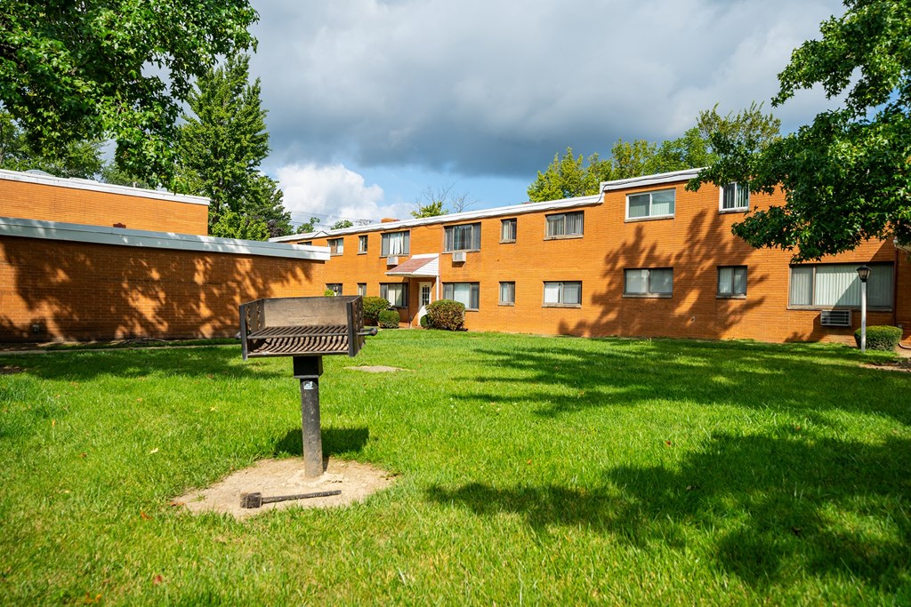 a grill in front of Arlen Terrace apartments