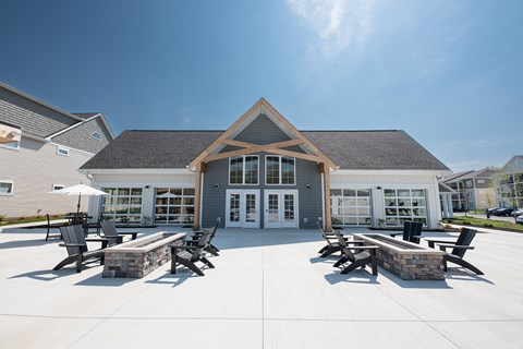 a patio with tables and chairs in front of a building at The Bend, Lancaster, OH, 43130