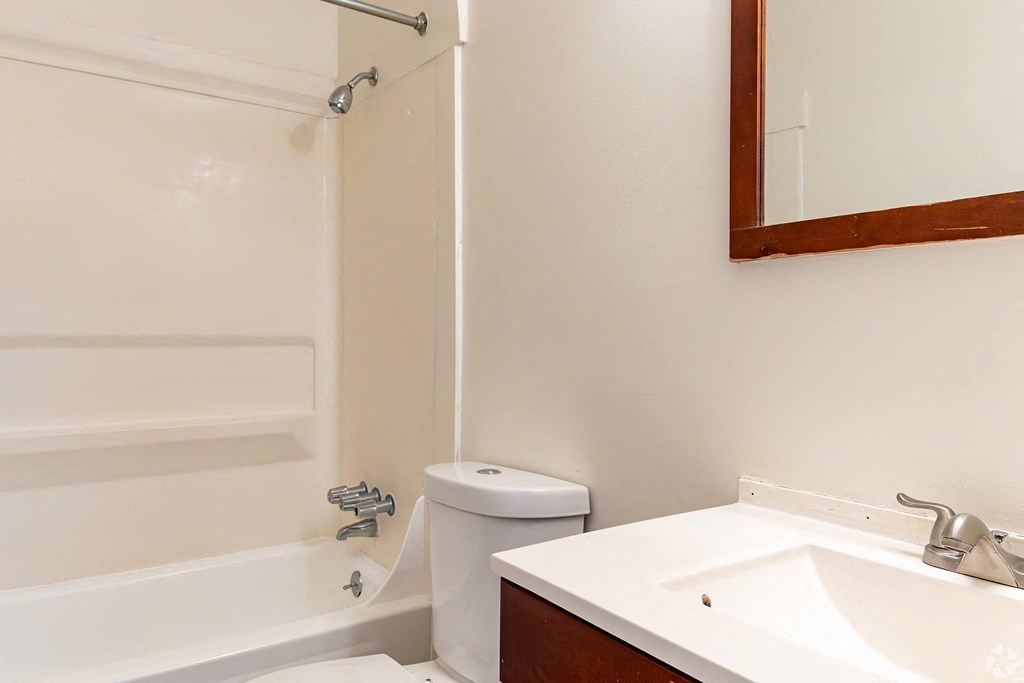 a bathroom with a sink toilet and a shower