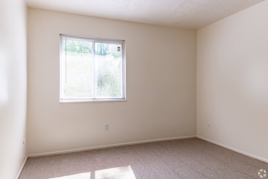 an empty room with a window in it