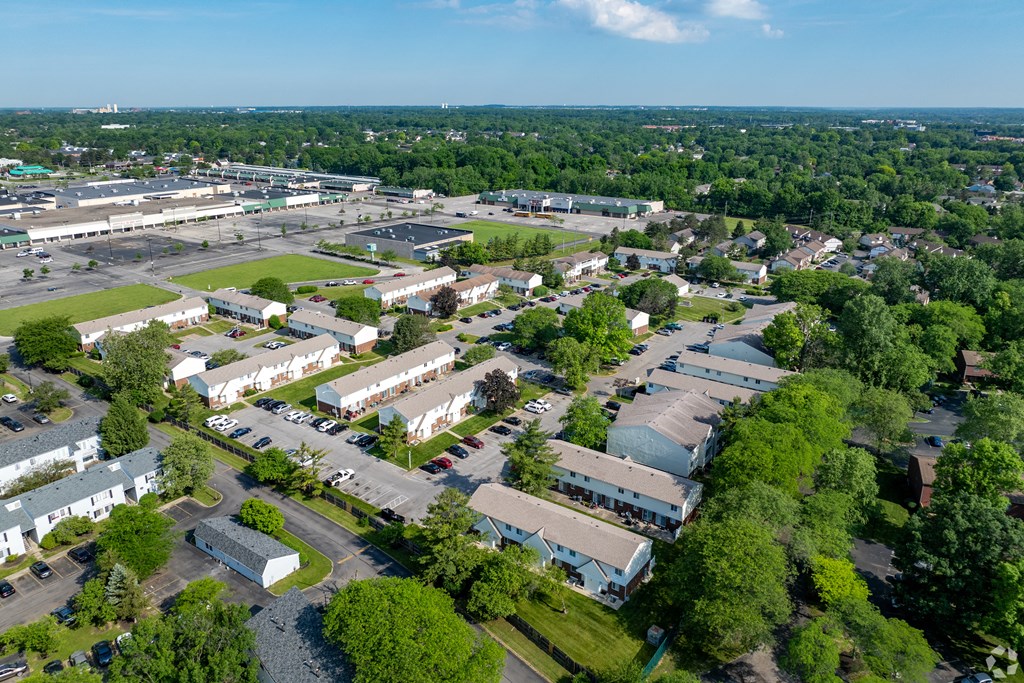 an aerial view of a city with buildings and trees