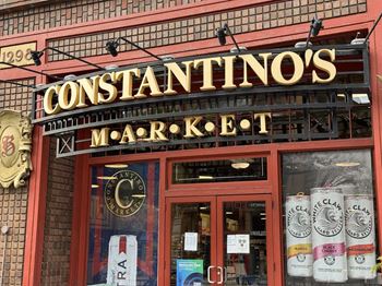 the front of a store with a sign in the window