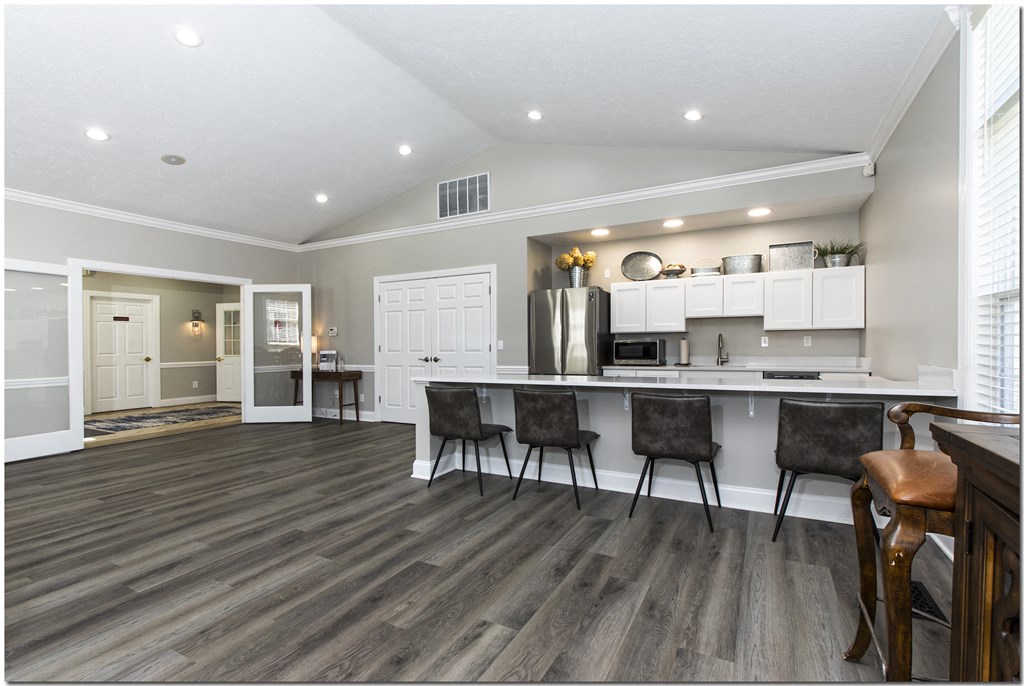 a kitchen and dining area in a 555 waverly unit