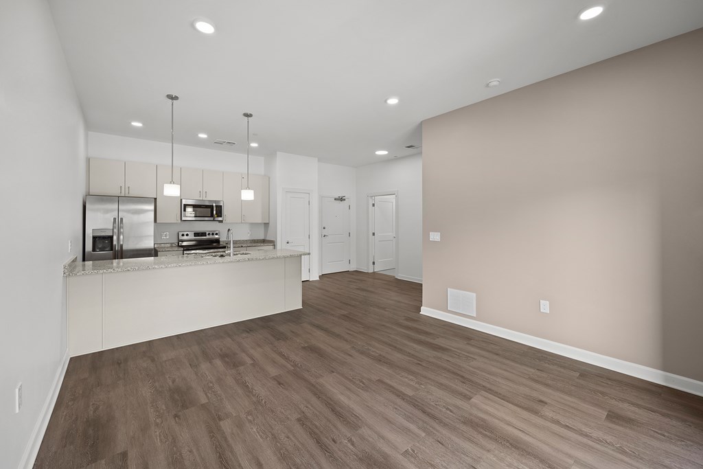 A kitchen with a countertop and cabinets is shown in this image. at The Lumos Apartments, Cleveland, OH
