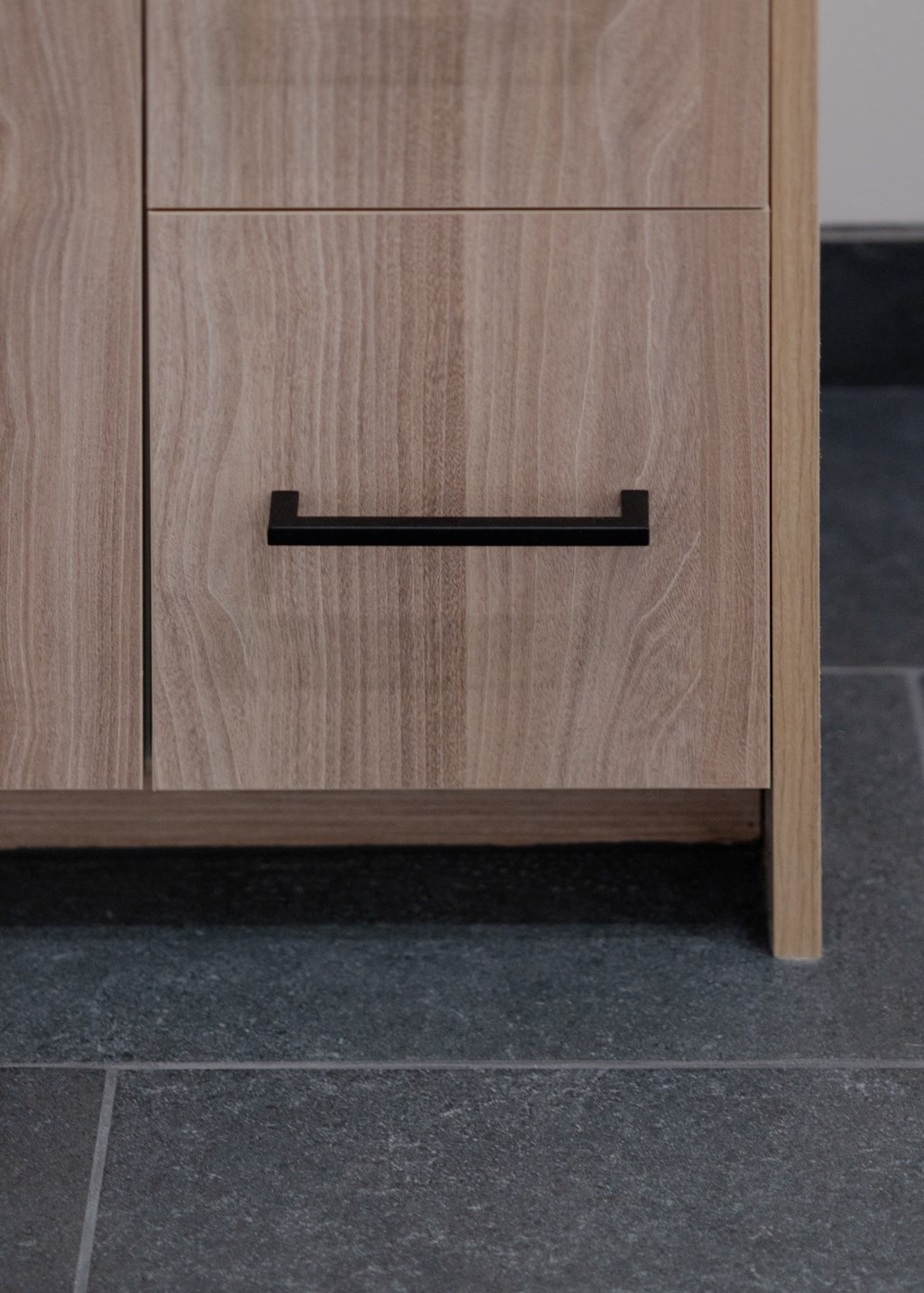 a wooden chest of drawers with a black drawer handle in Rocky River, OH 44116