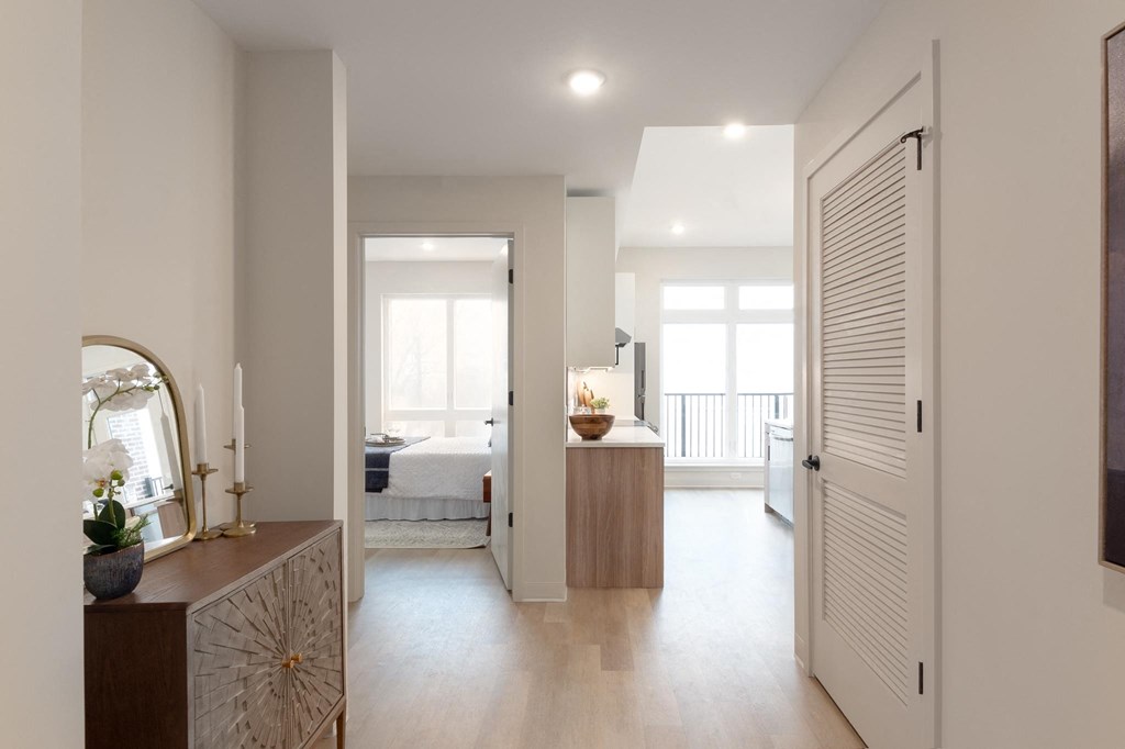 a hallway with a bedroom in the background and a door leading to a bedroom in Rocky River, OH 44116