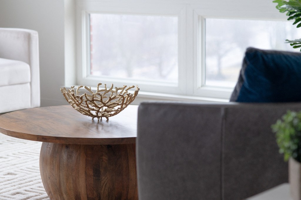 a living room with a wooden table with a gold bowl on it in Rocky River, OH 44116