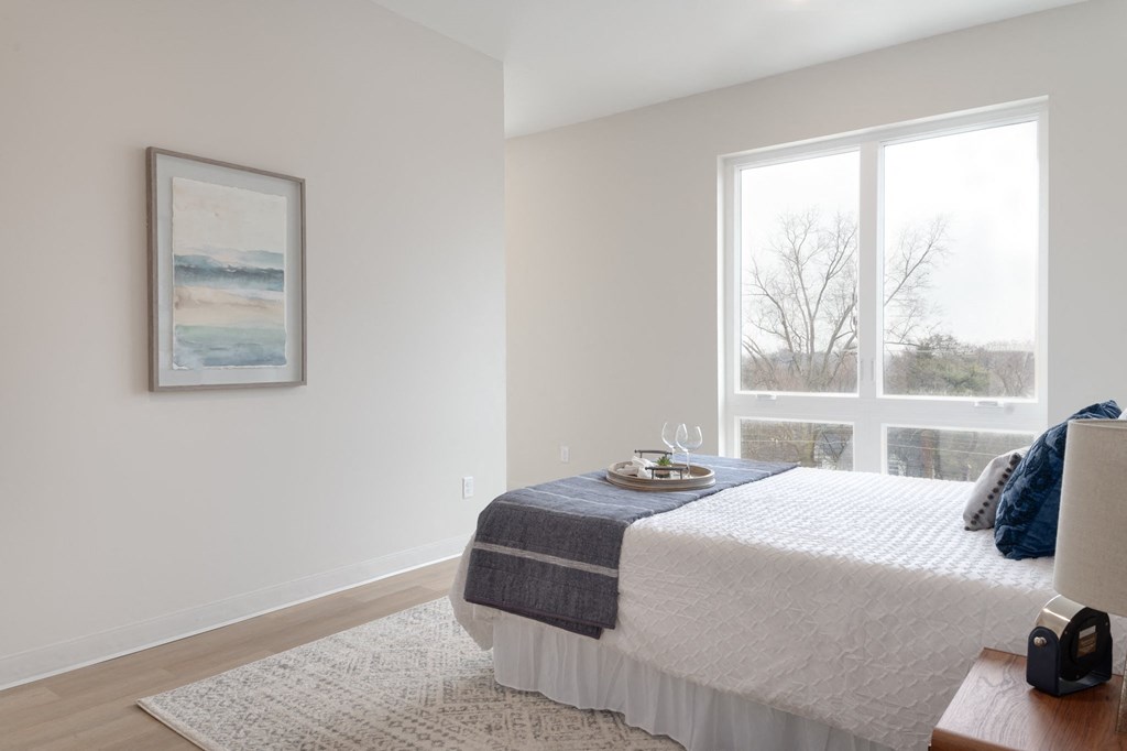 a bedroom with a bed and two windows in Rocky River, OH 44116