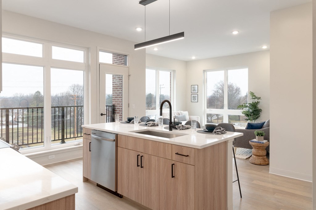a kitchen with a large island and a view of a living room in Rocky River, OH 44116