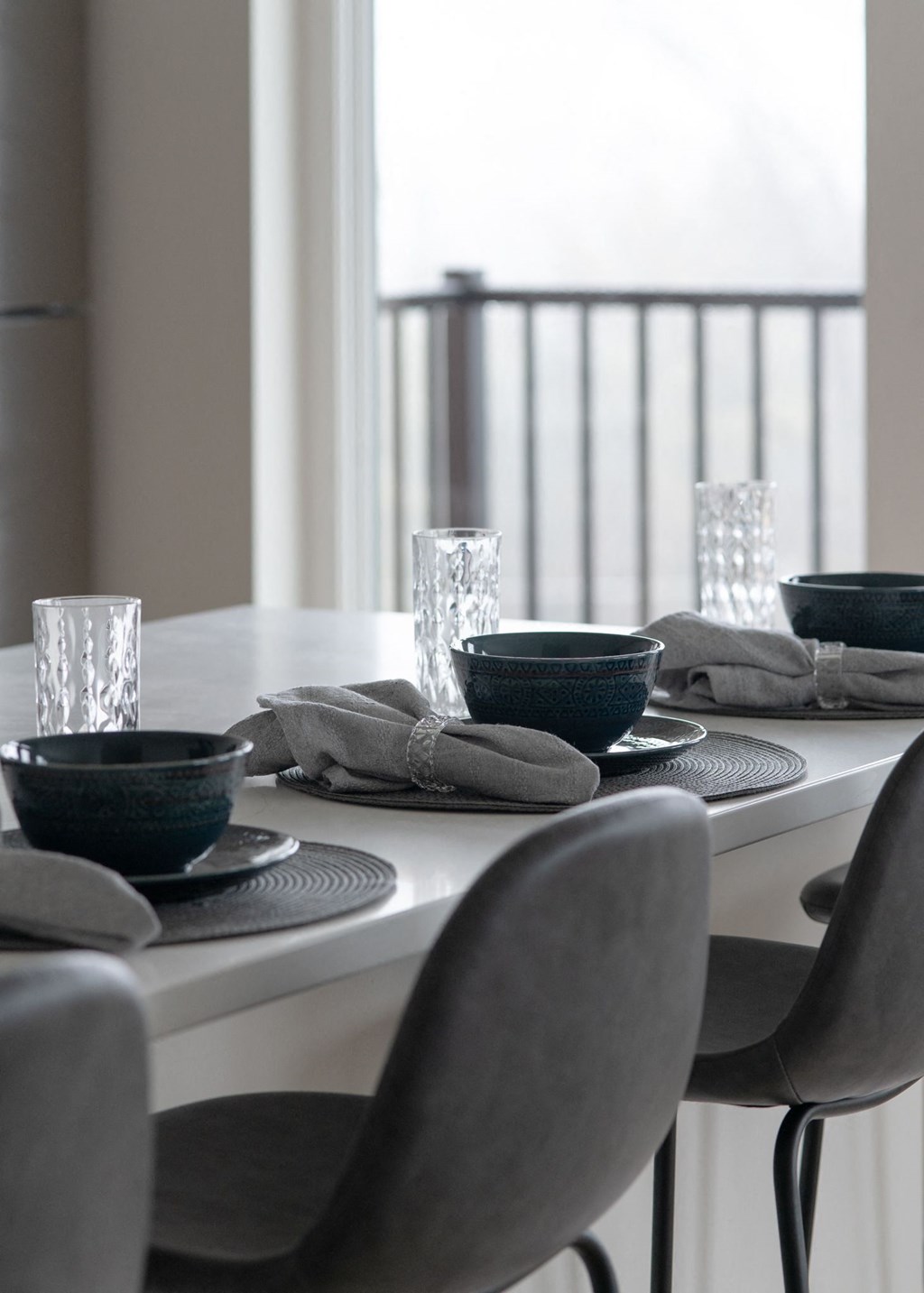 a dining table with chairs and bowls and glasses on it in Rocky River, OH 44116