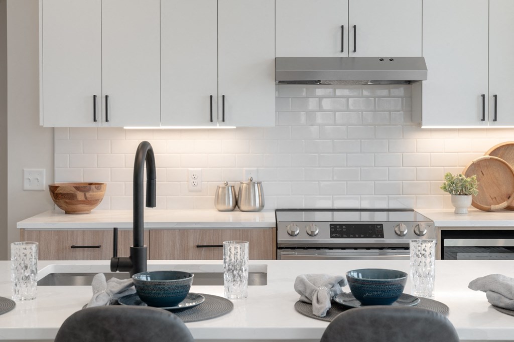a kitchen with white cabinets and a white counter top and a sink in Rocky River, OH 44116