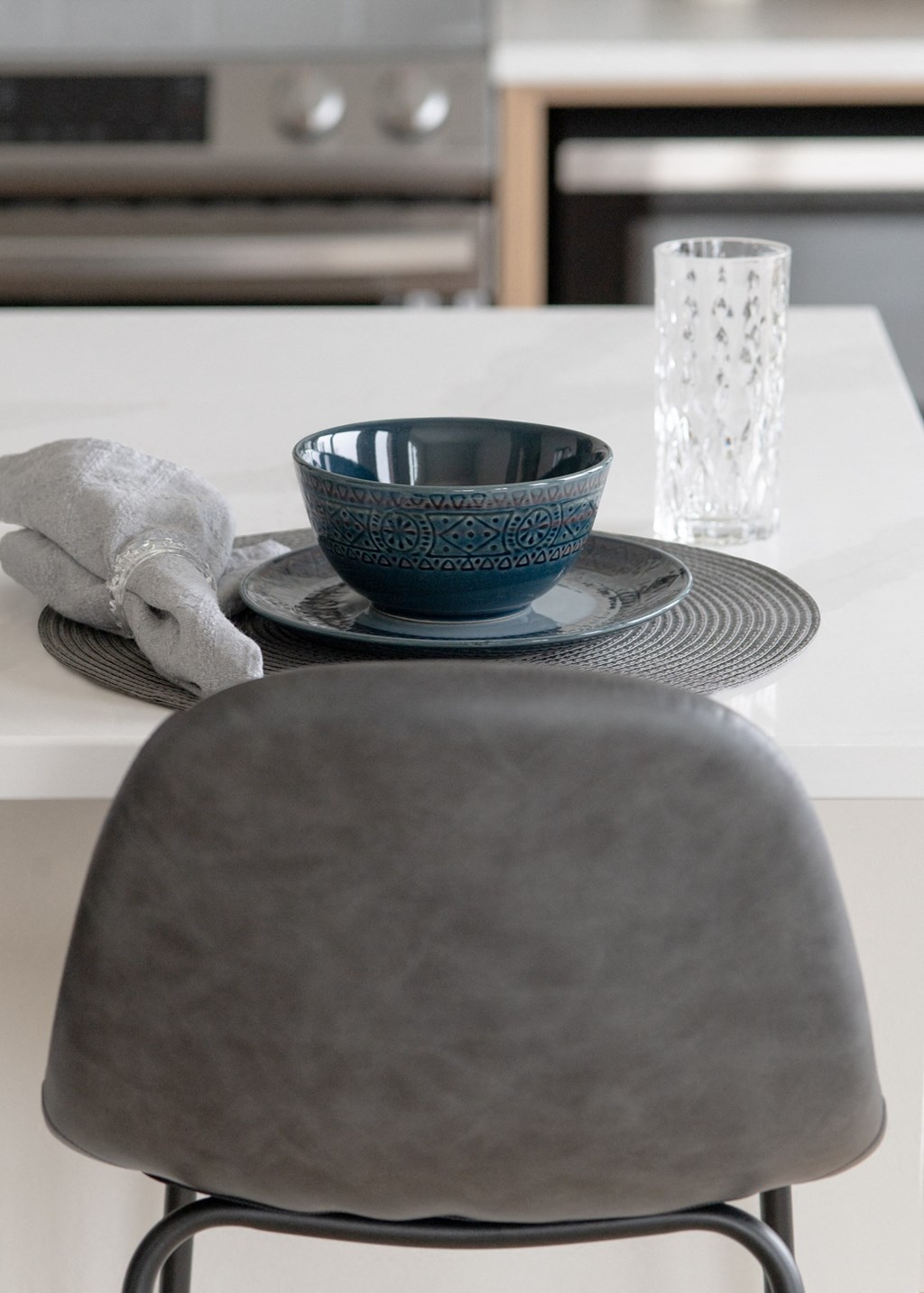 a bowl on a plate on a table with a chair in Rocky River, OH 44116