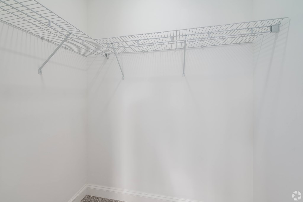 Empty wire shelving in a white room. at Park Lamont Townhomes Apartments, Cleveland