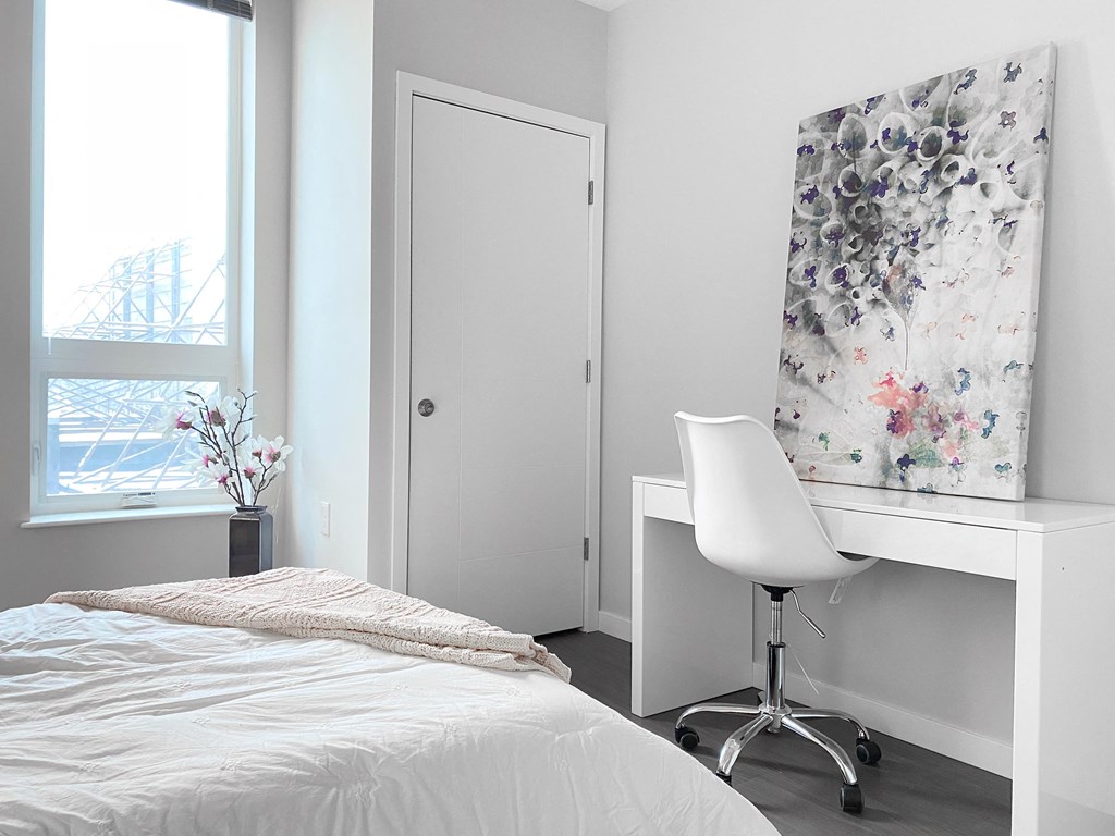 spacious bedroom with office desk