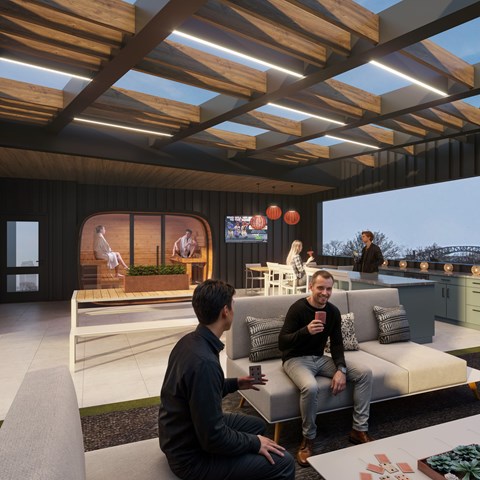 Two men are sitting on a couch in a modern living room.