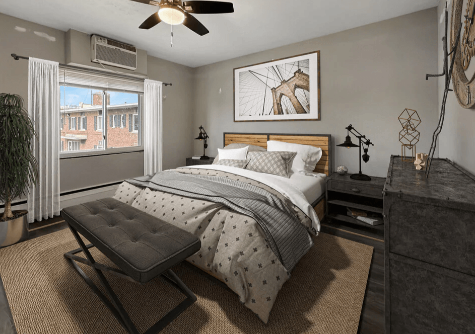 a bedroom with a bed and a ceiling fan