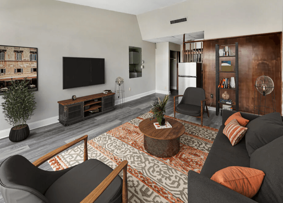 a living room with a couch and a tv